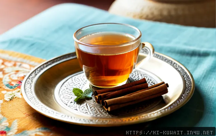 Home 15 쿠웨이트 전통 허브티 - Photorealistic close-up of traditional Kuwaiti herbal tea served in a small clear glass cup on an el...